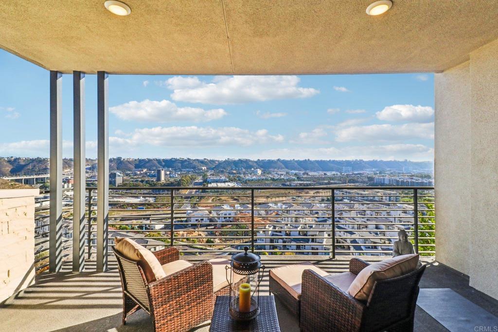 a view of a balcony with lake view and mountain view