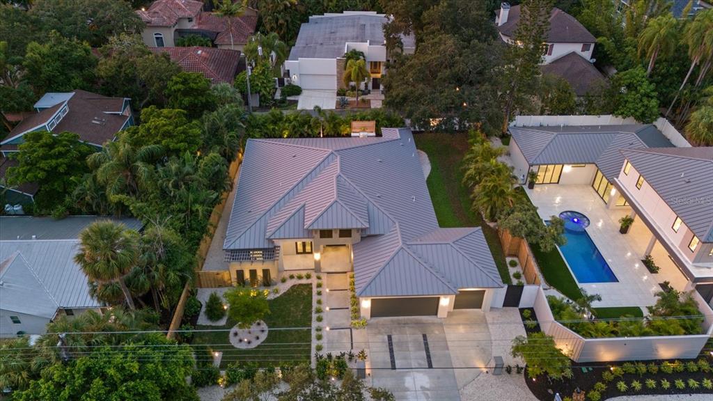 an aerial view of multiple houses with yard