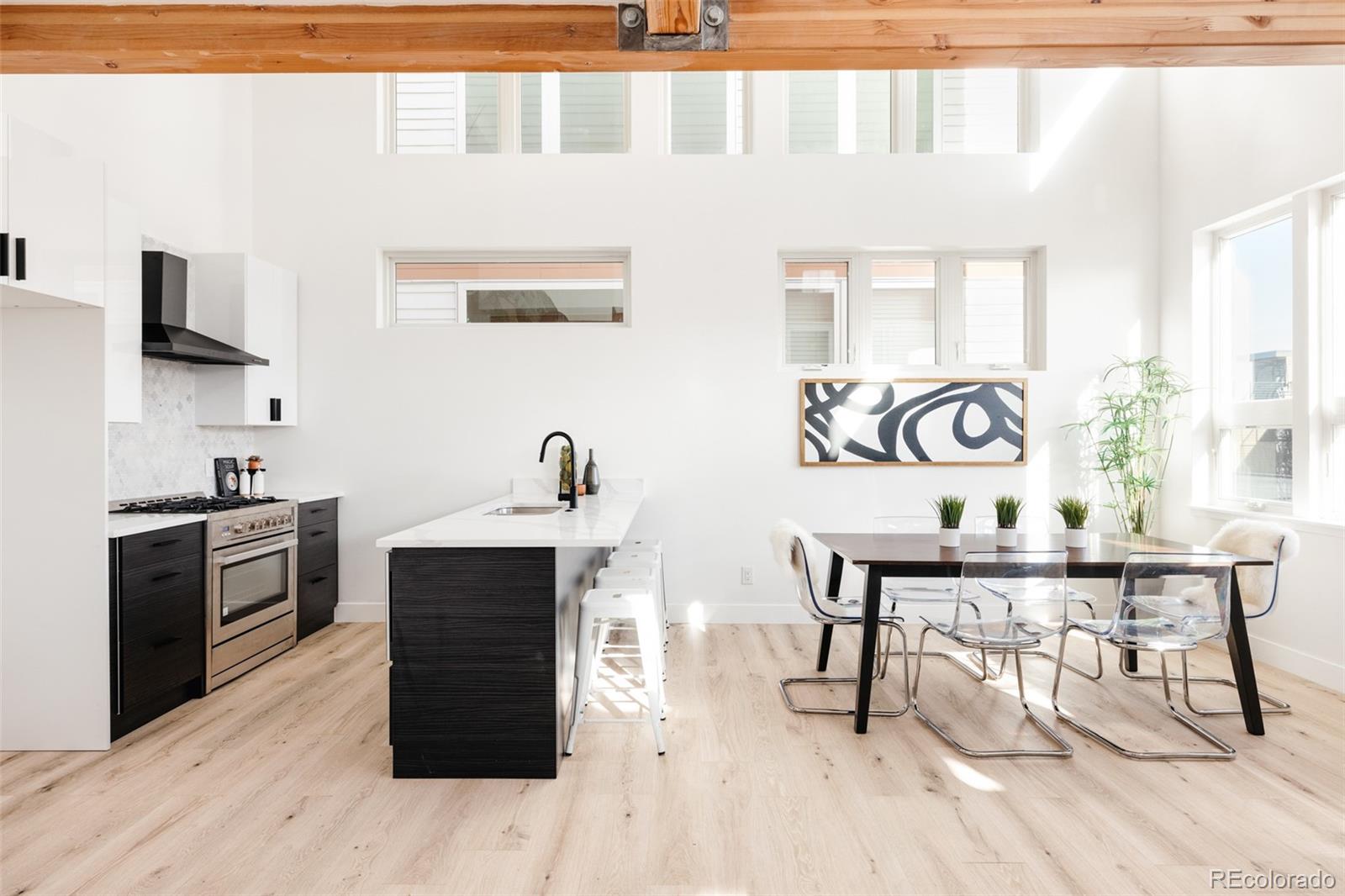 a kitchen with a stove a sink and a refrigerator