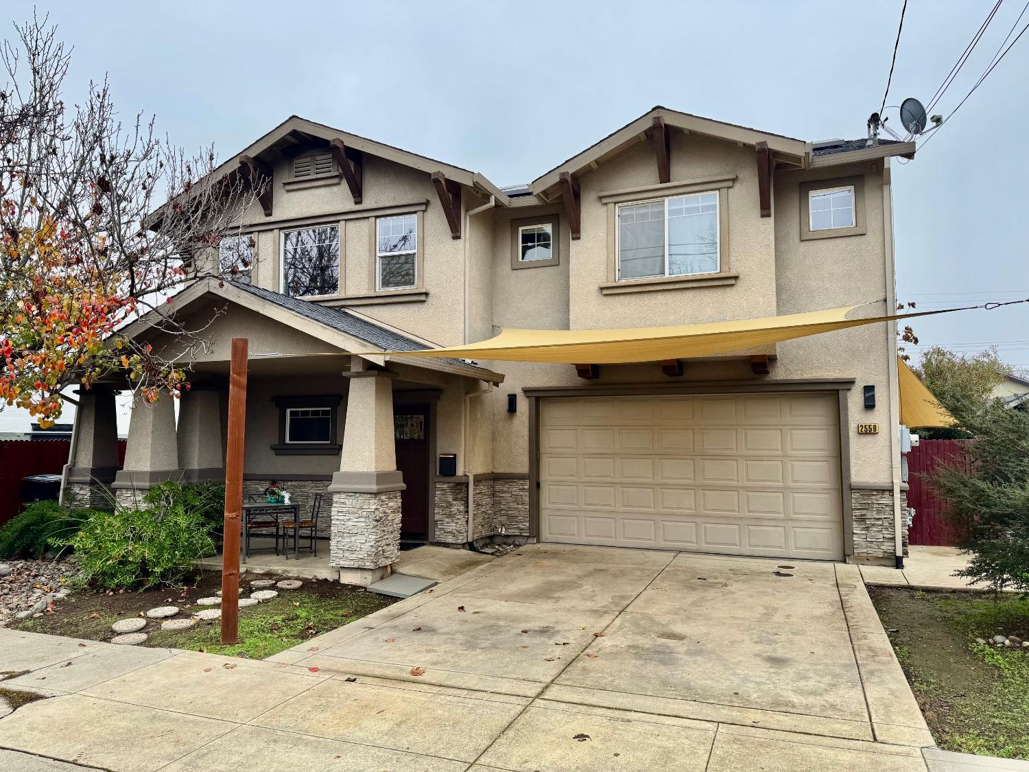 a front view of a house with garage