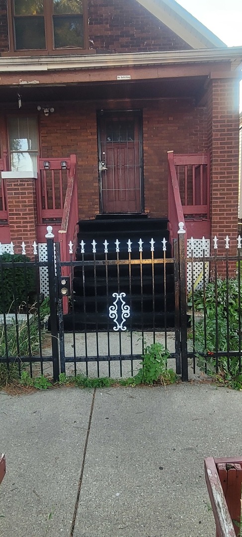 a view of brick house with large windows