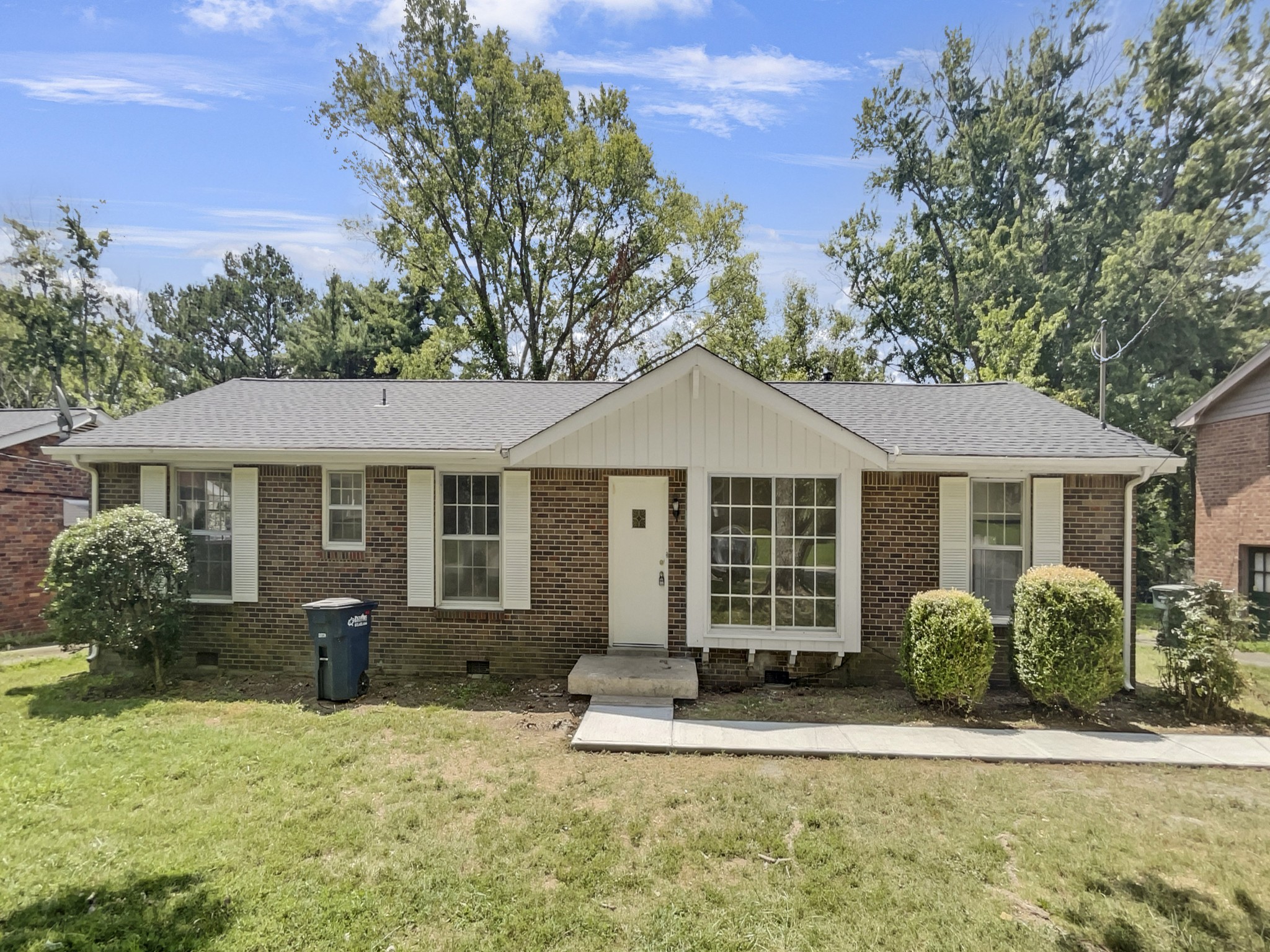 front view of a house with a yard