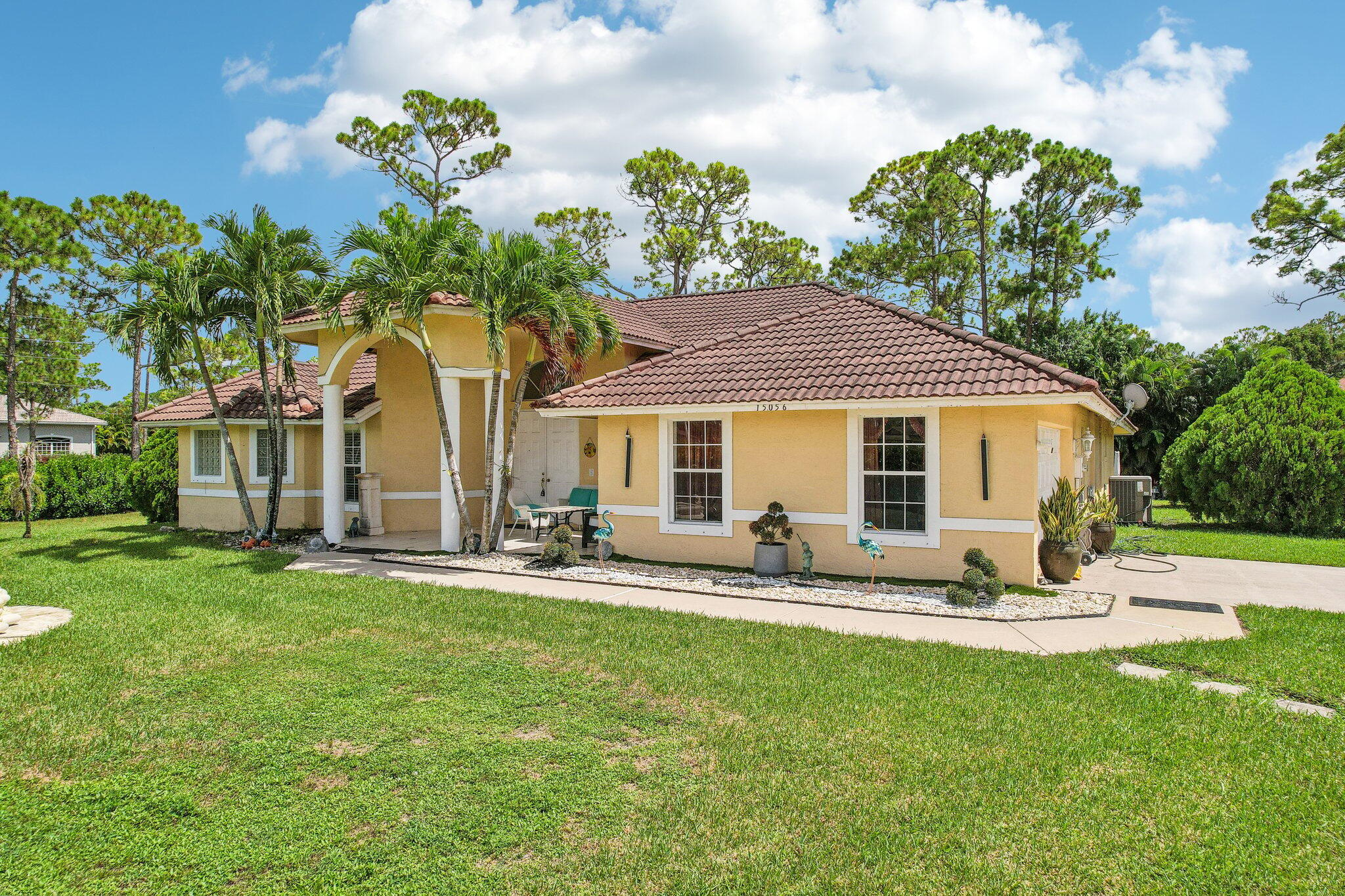 a front view of house with yard and seating area