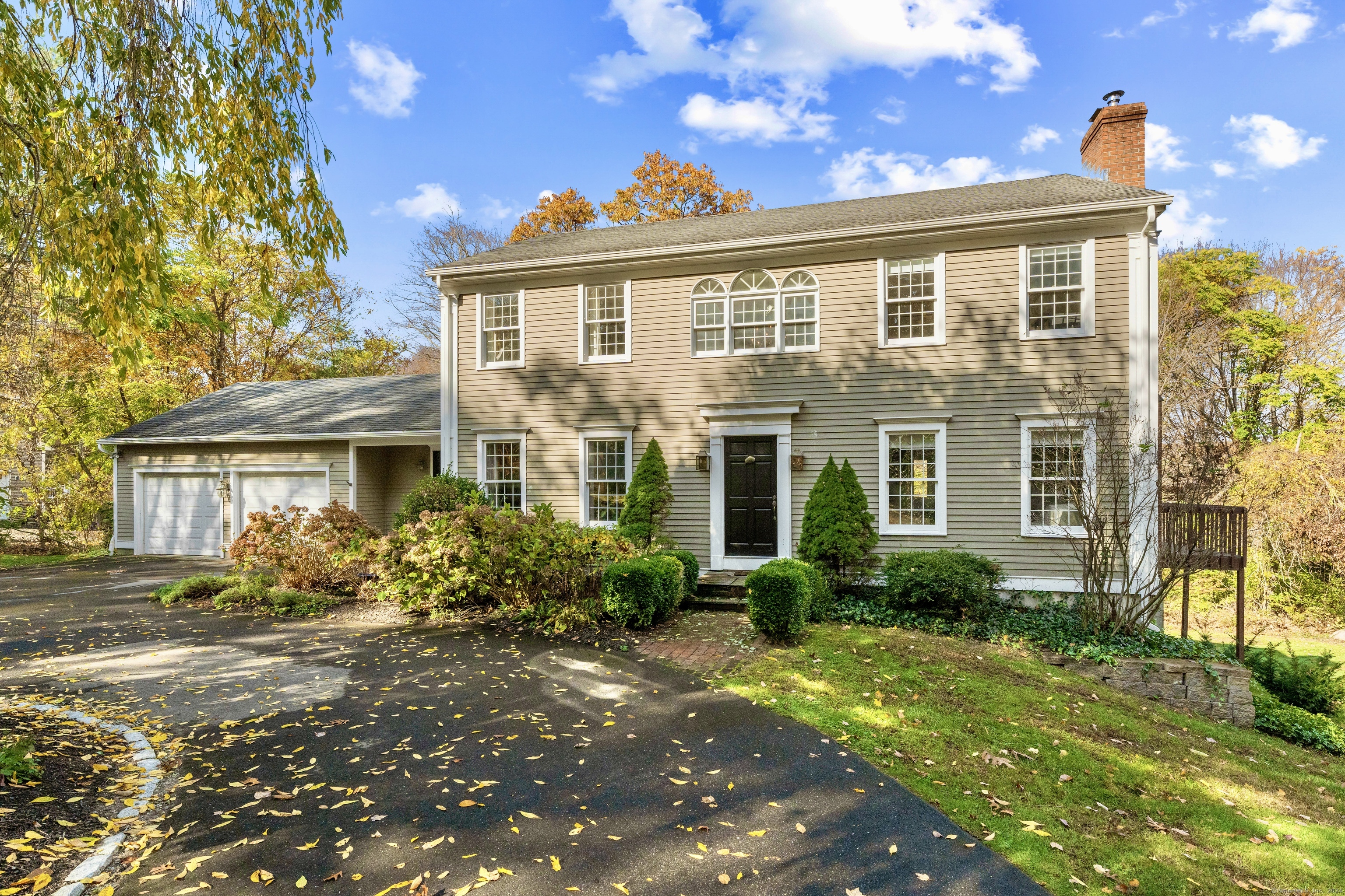 front view of a house with a yard