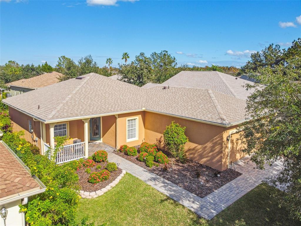 a aerial view of a house with a yard