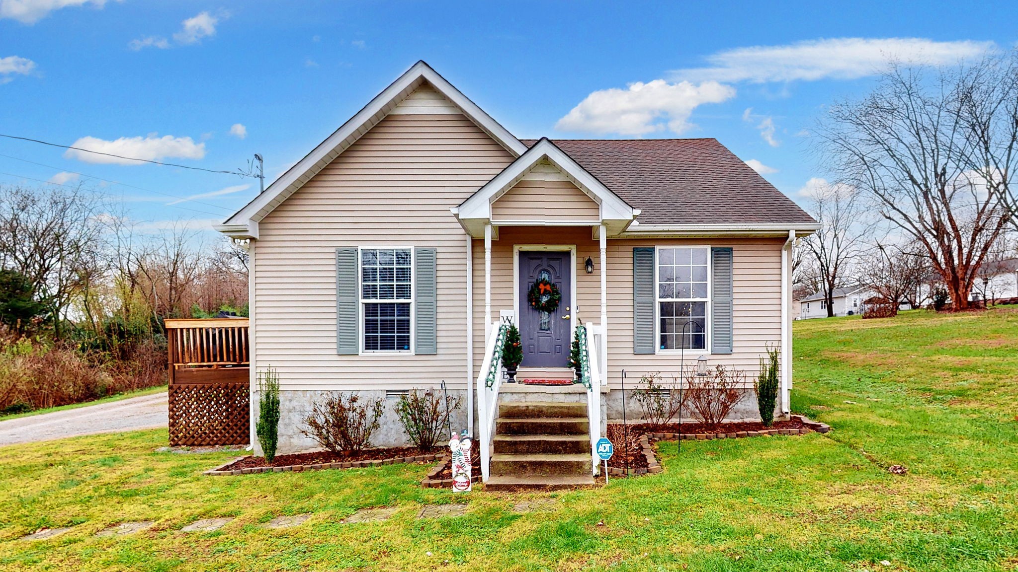 a front view of a house with a yard