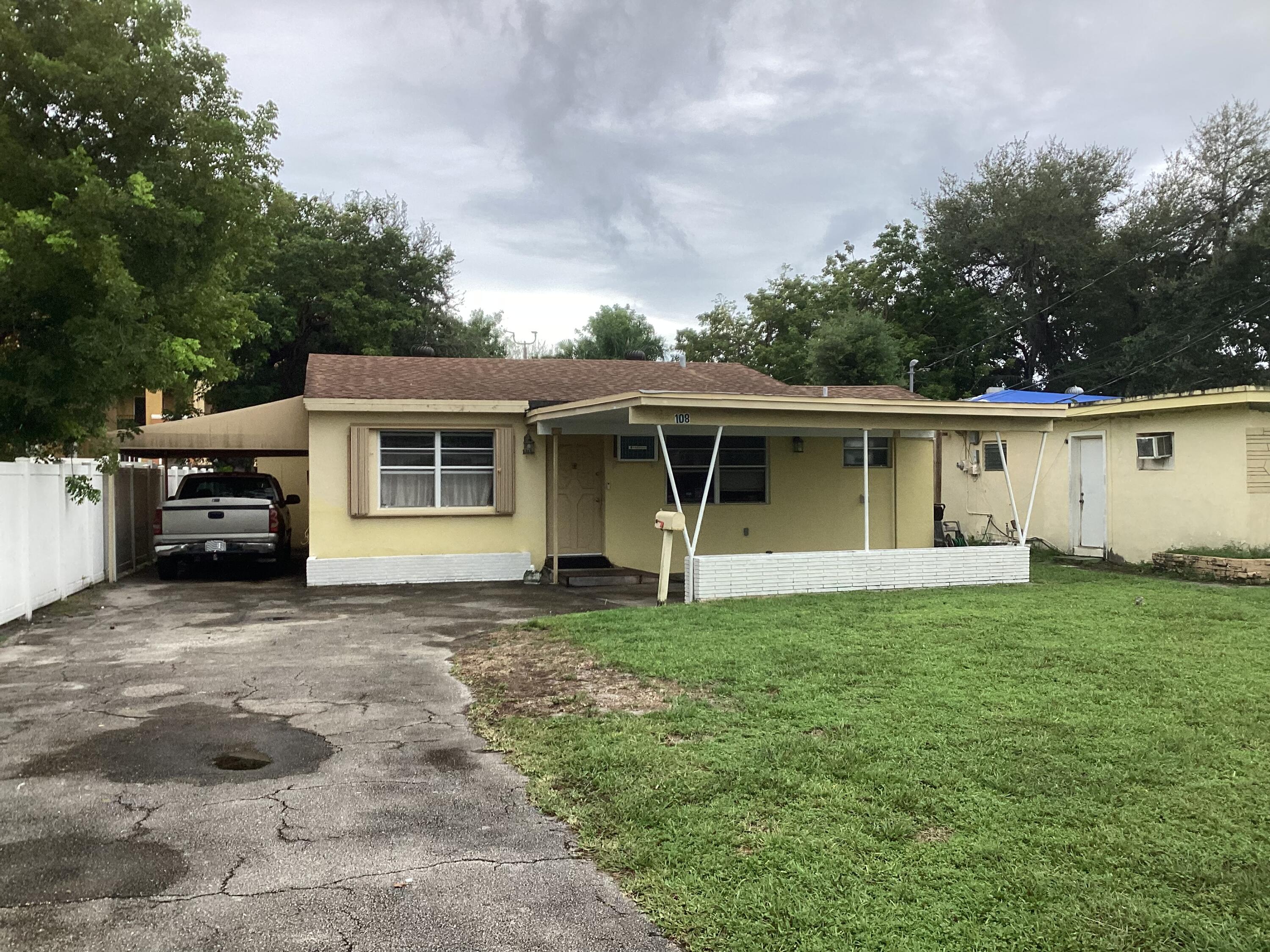 front view of a house with a yard