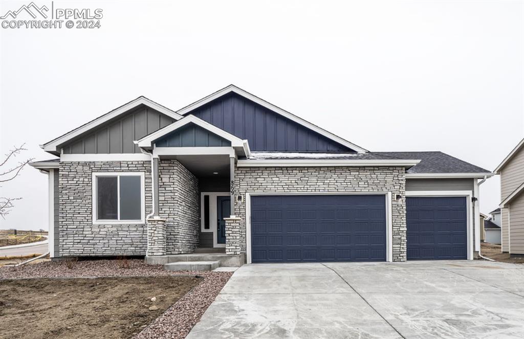 a front view of a house with garage