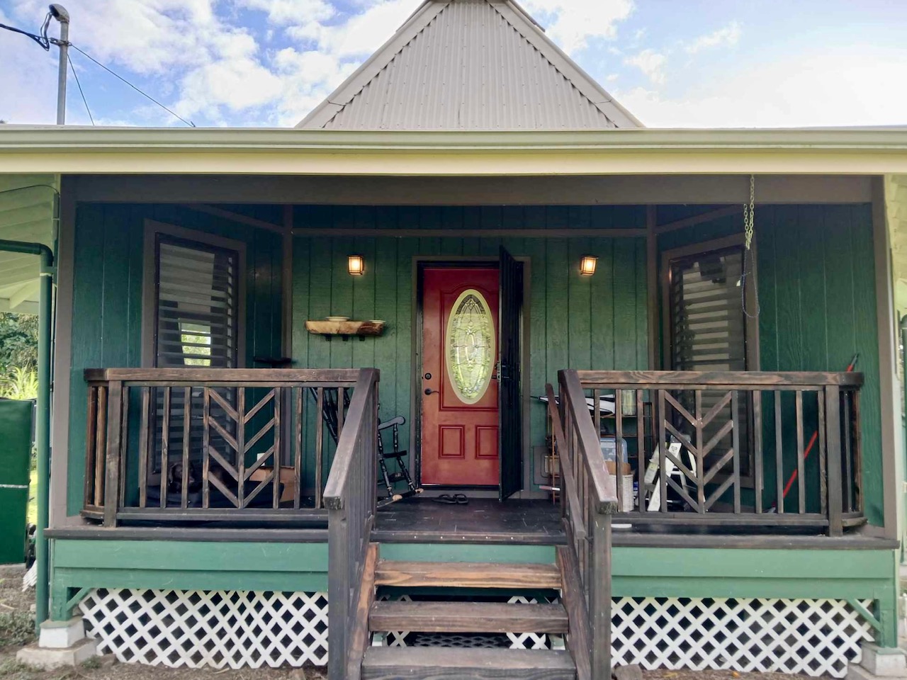 a view of a door of a house with a small yard