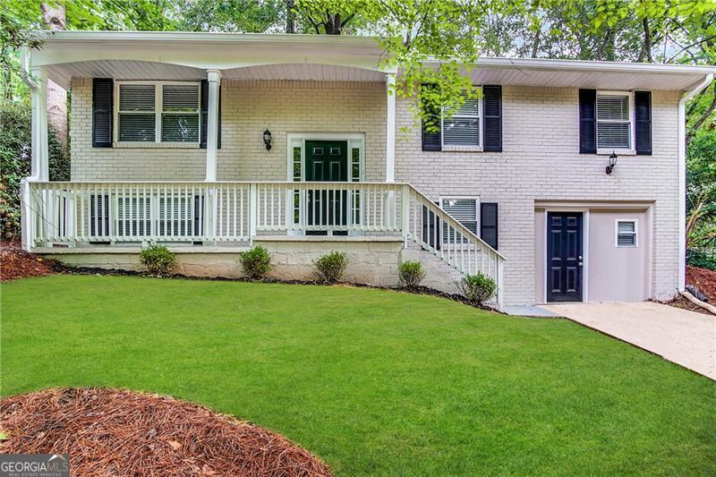 front view of a house with a yard