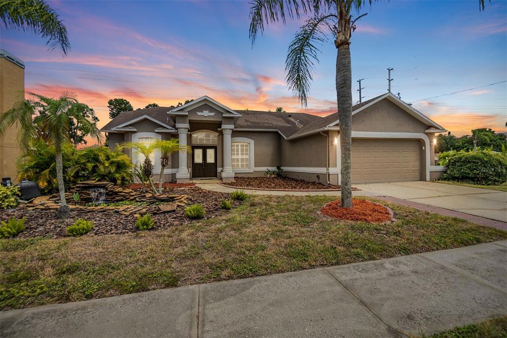 a front view of a house with a yard