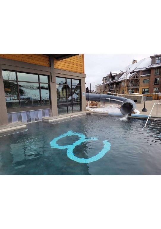 a view of a swimming pool with a patio