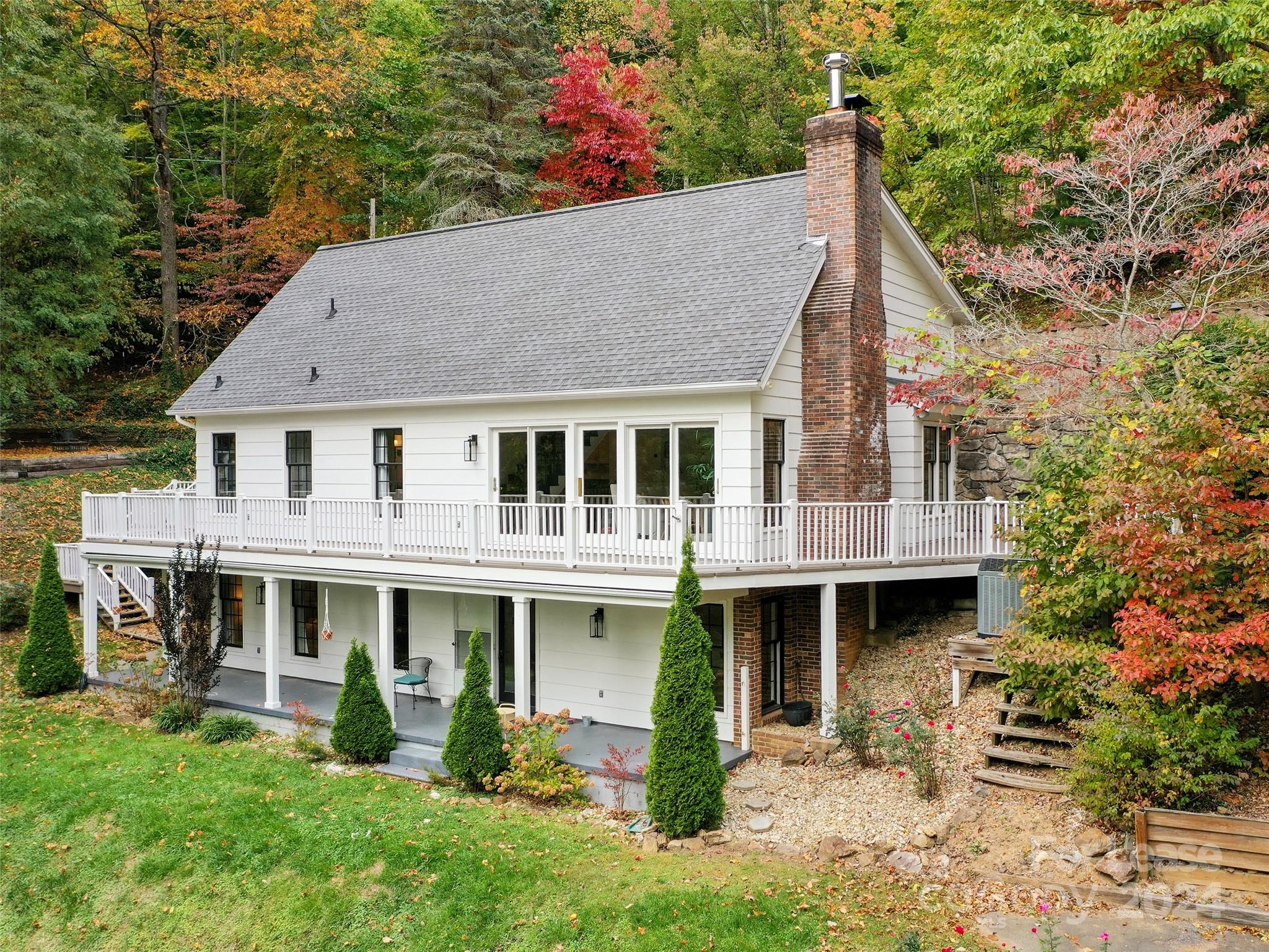 a aerial view of a house with swimming pool