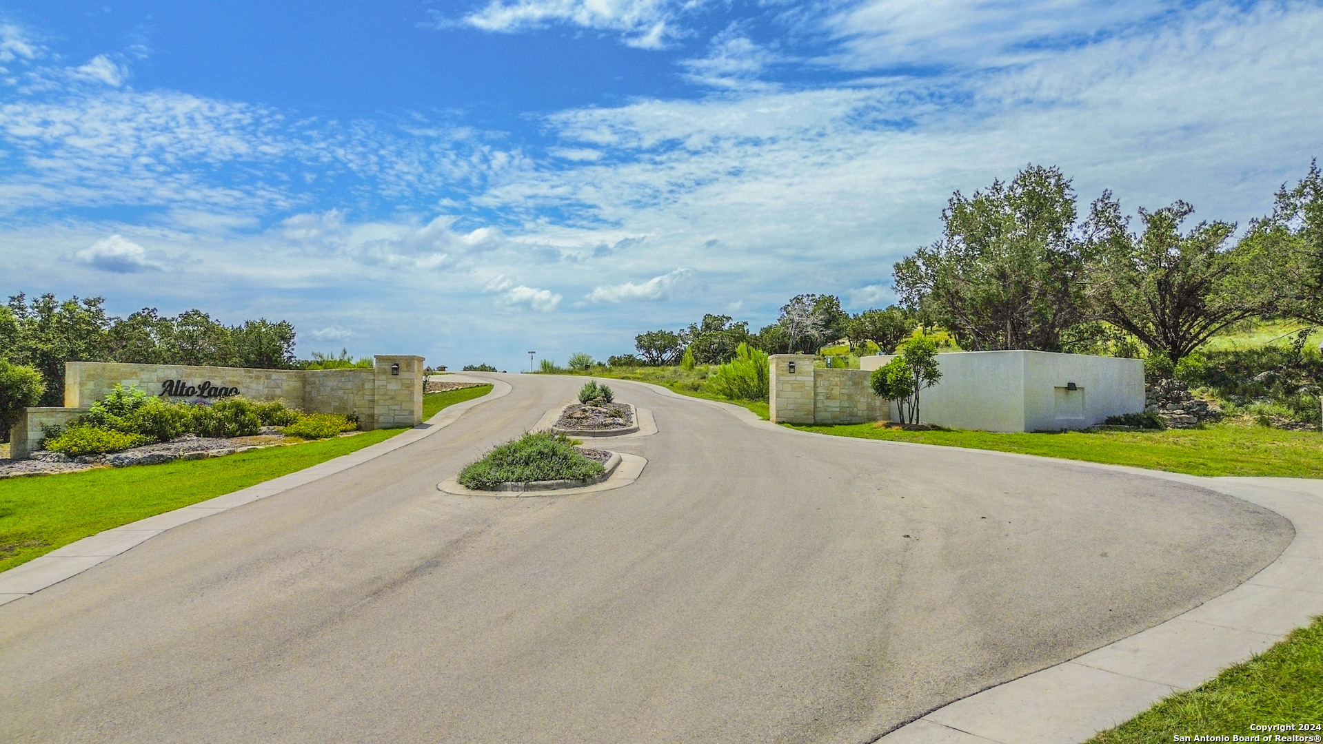 a view of a street with an ocean view