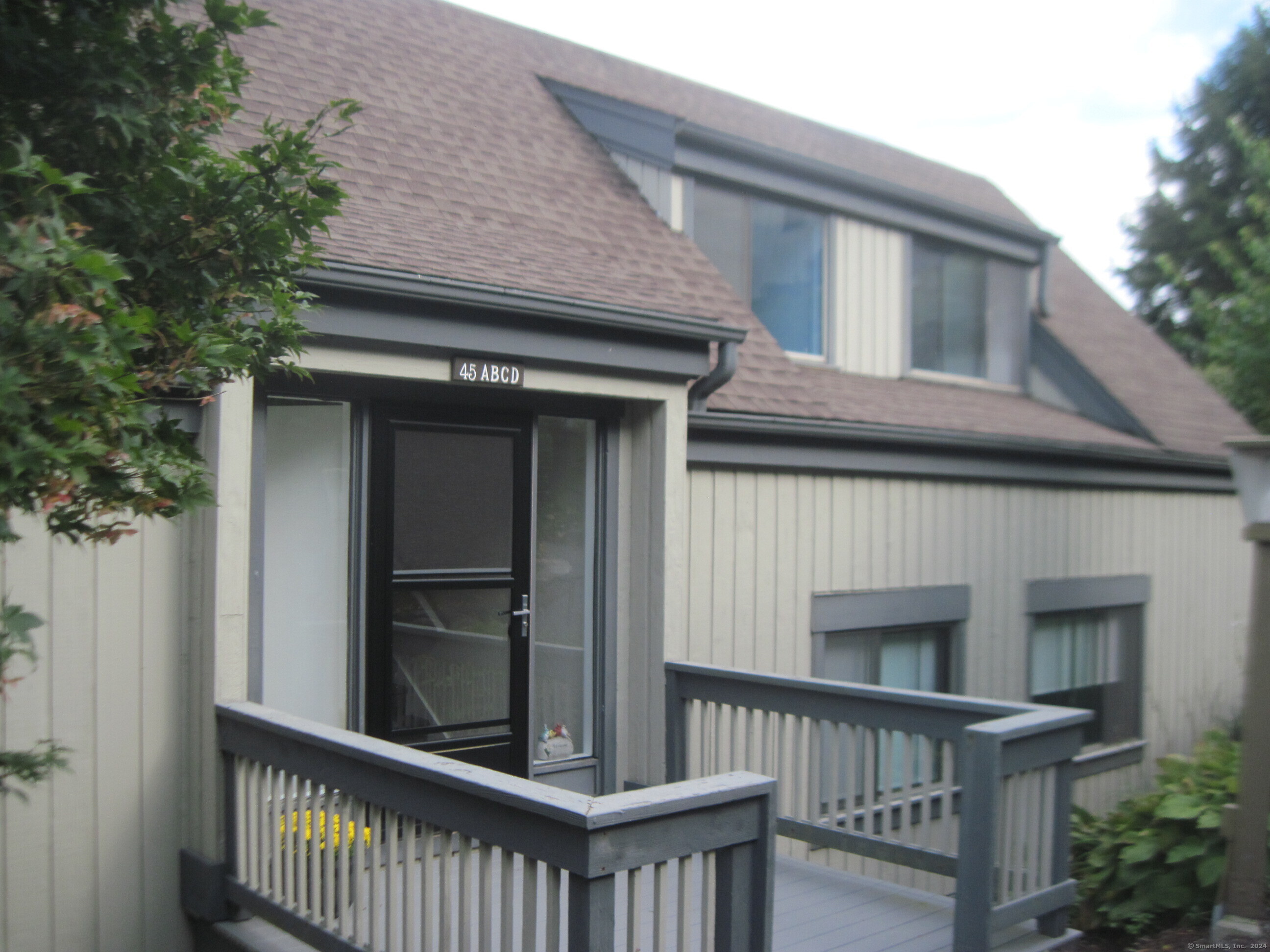 a view of a house with a large window