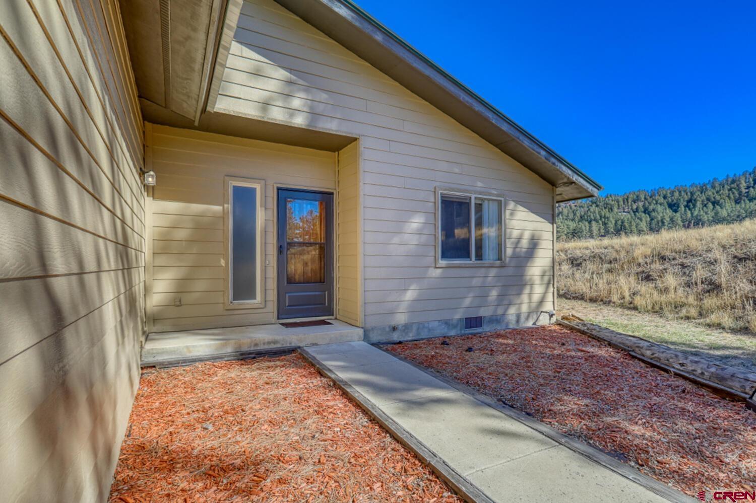 a view of backyard of a house