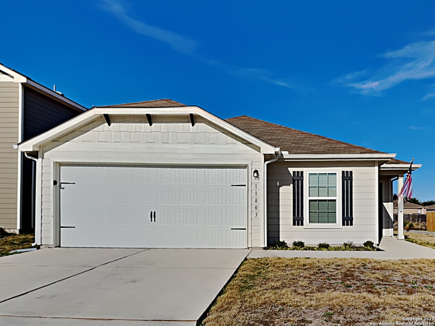 a front view of a house with a yard