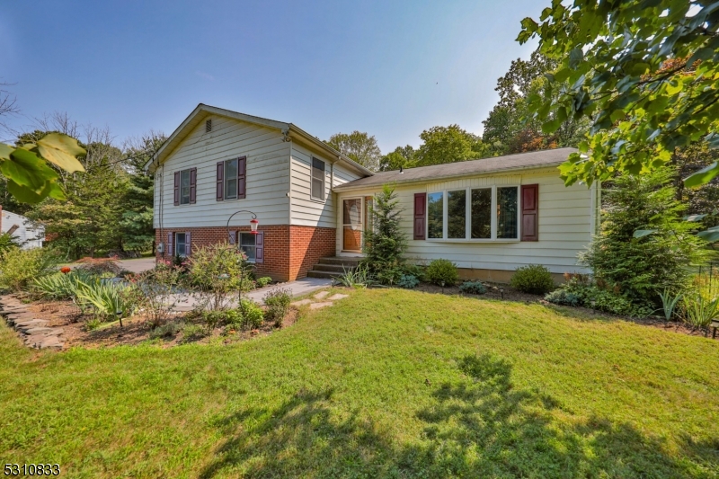 a house view with a garden space