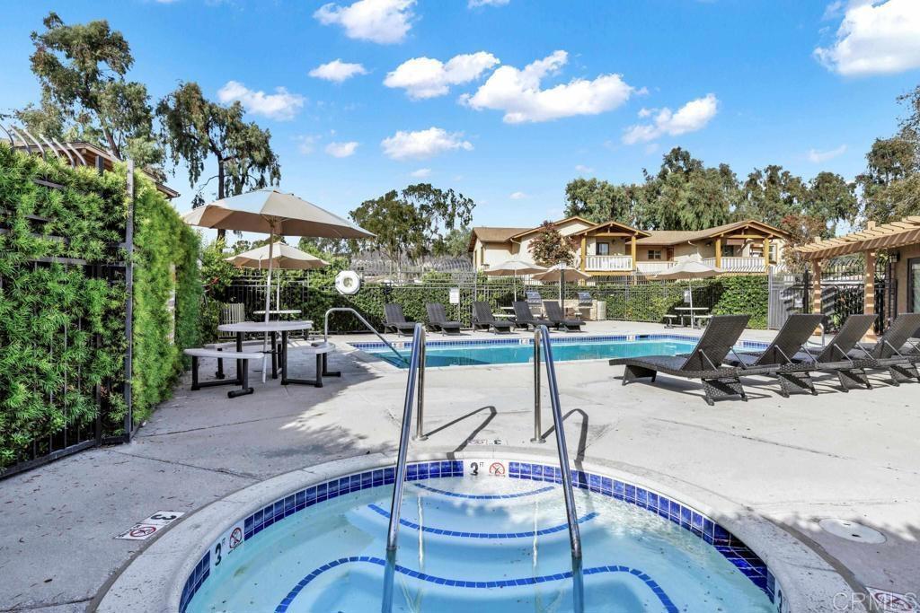 a swimming pool with outdoor seating yard and mountain view