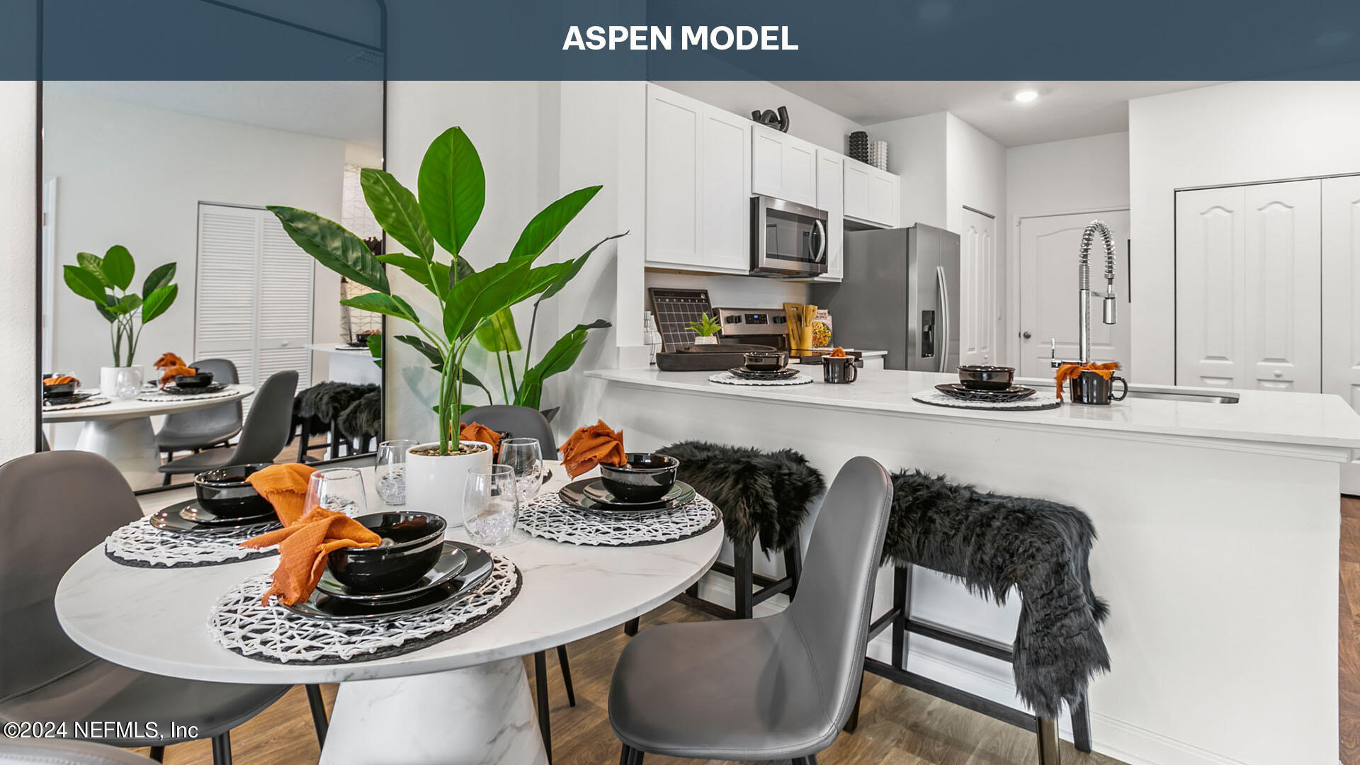 a kitchen with a table and chairs in it