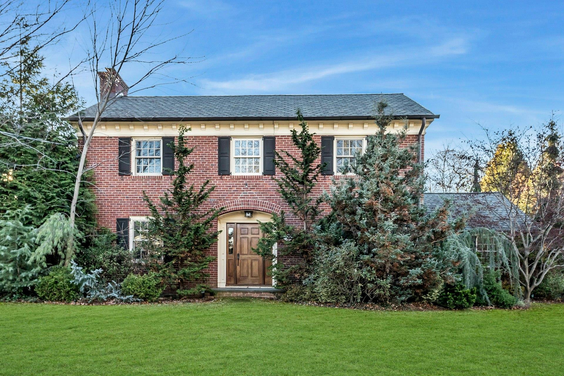 View of front of property with a front lawn