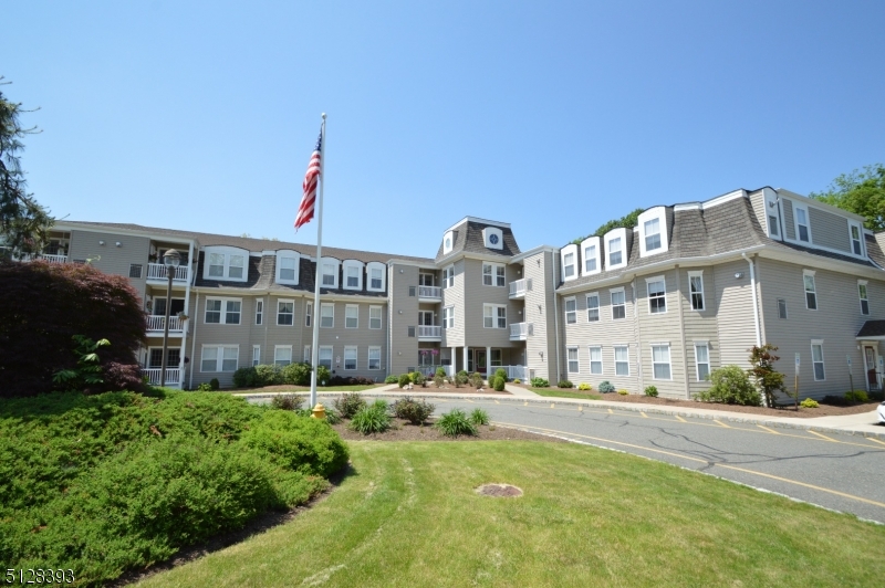 a view of a building with a yard