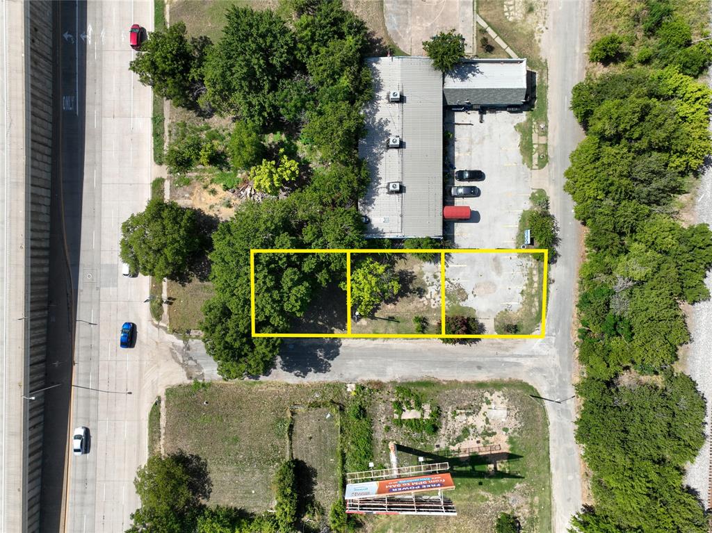 an aerial view of a house with outdoor space