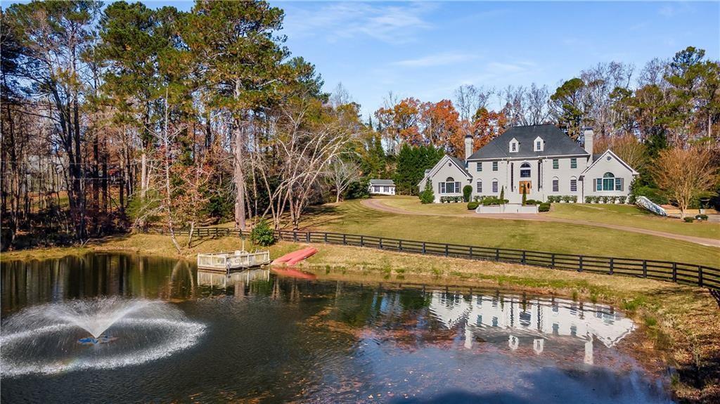 a view of a lake with a house in the background