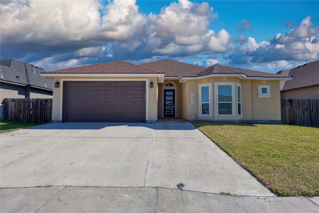 front view of a house with a yard