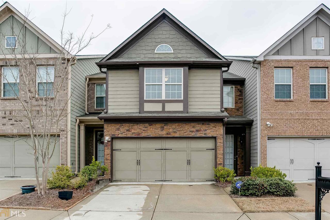 a front view of a house with garage