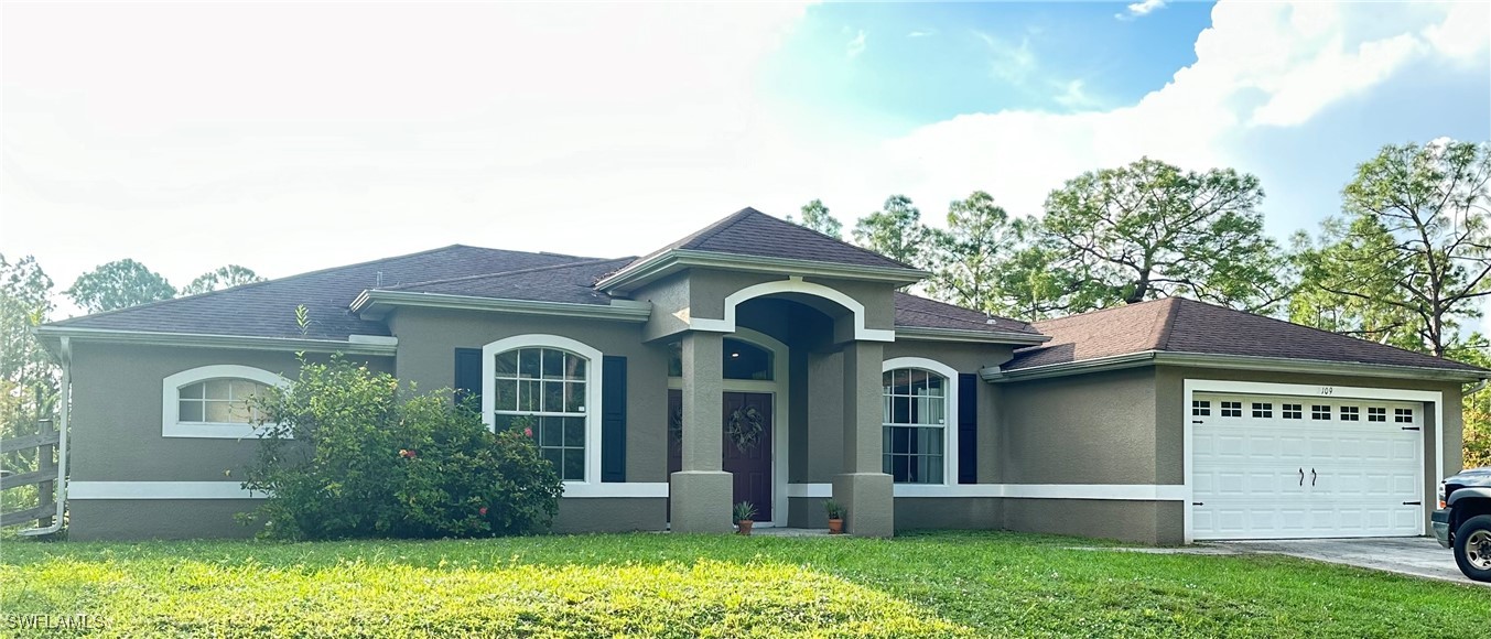 front view of a house with a yard