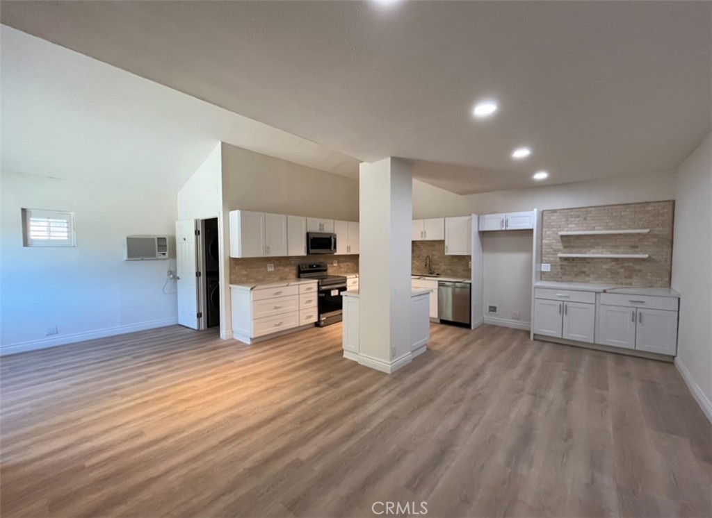 a view of kitchen with wooden floor