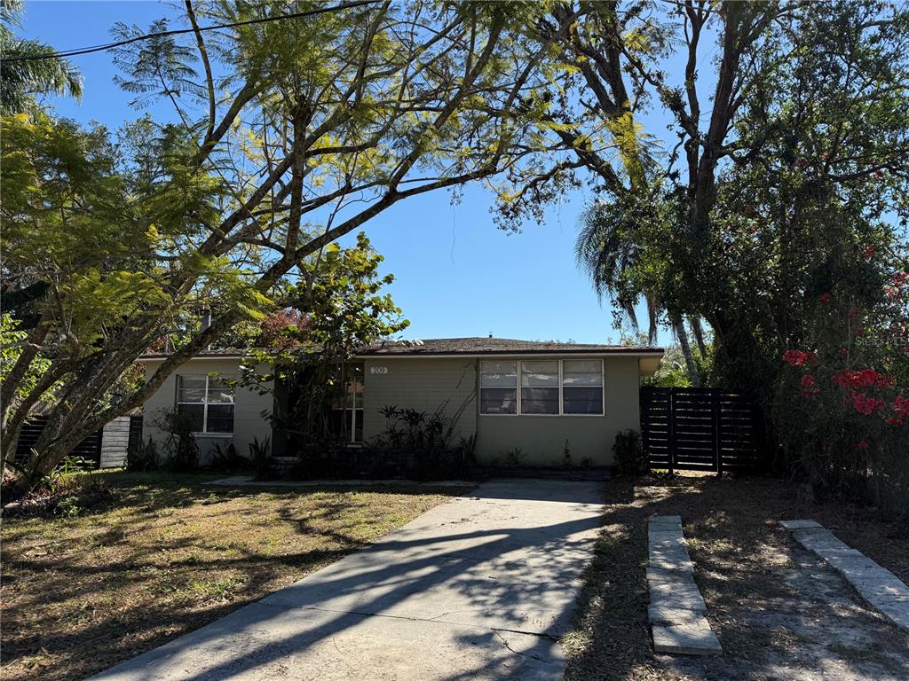 a house with trees in the background