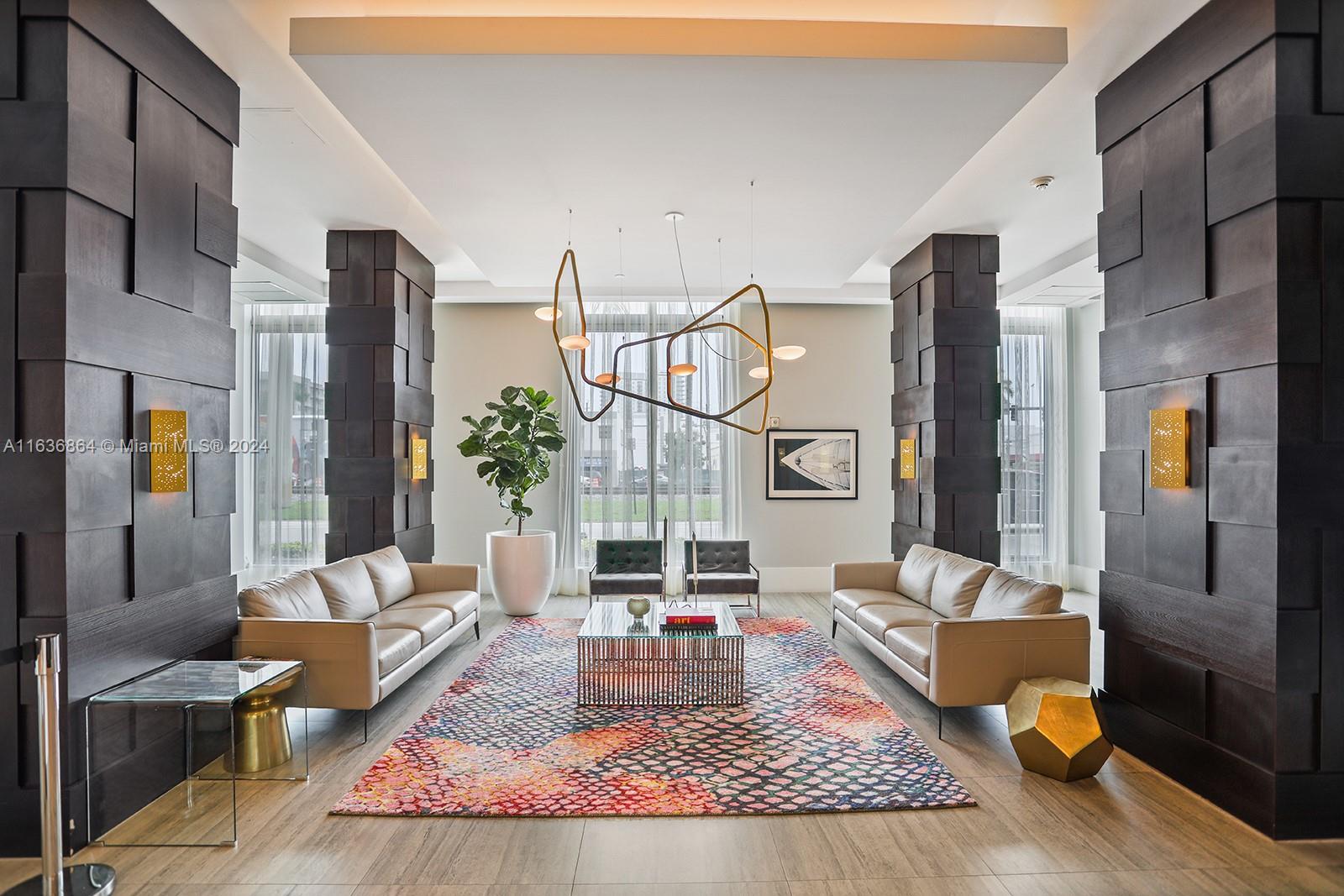 a living room with furniture fireplace and rug