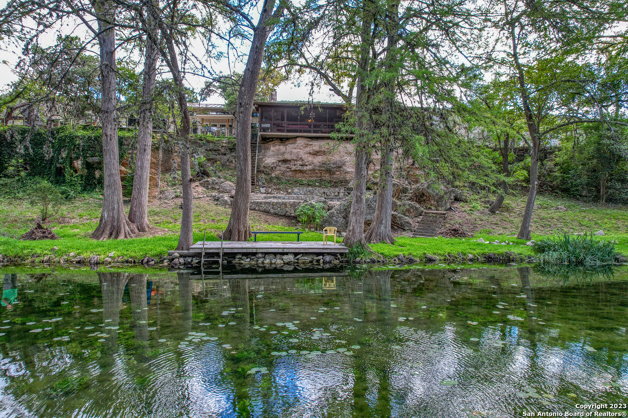 a view of a lake with a building in the background