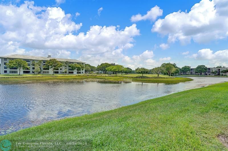 a view of a lake with houses in the back