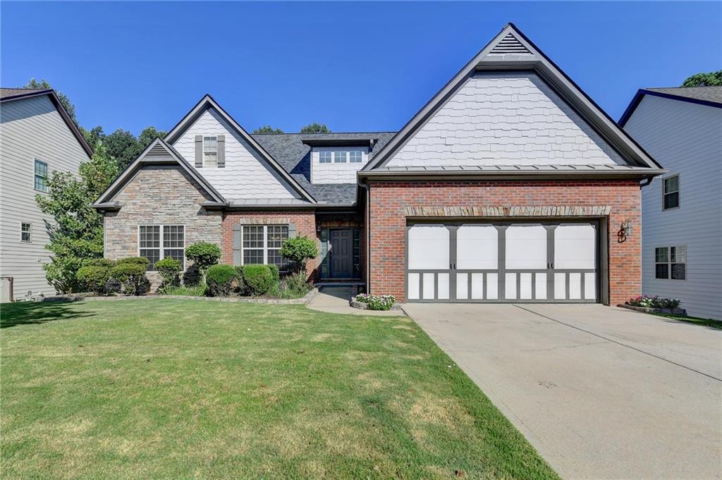 a front view of a house with a yard