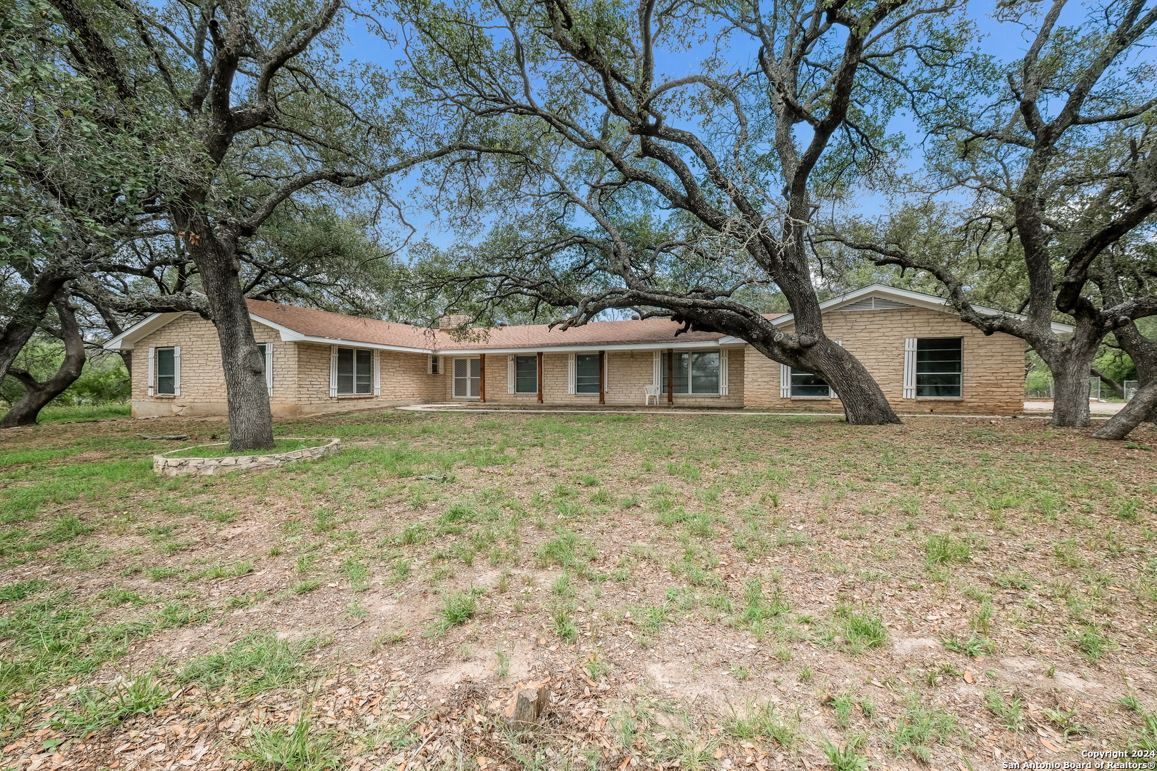 a house with trees in front of it