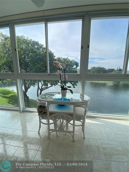 a dining room with a table and chairs