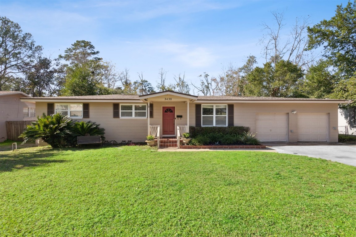 front view of a house with a yard