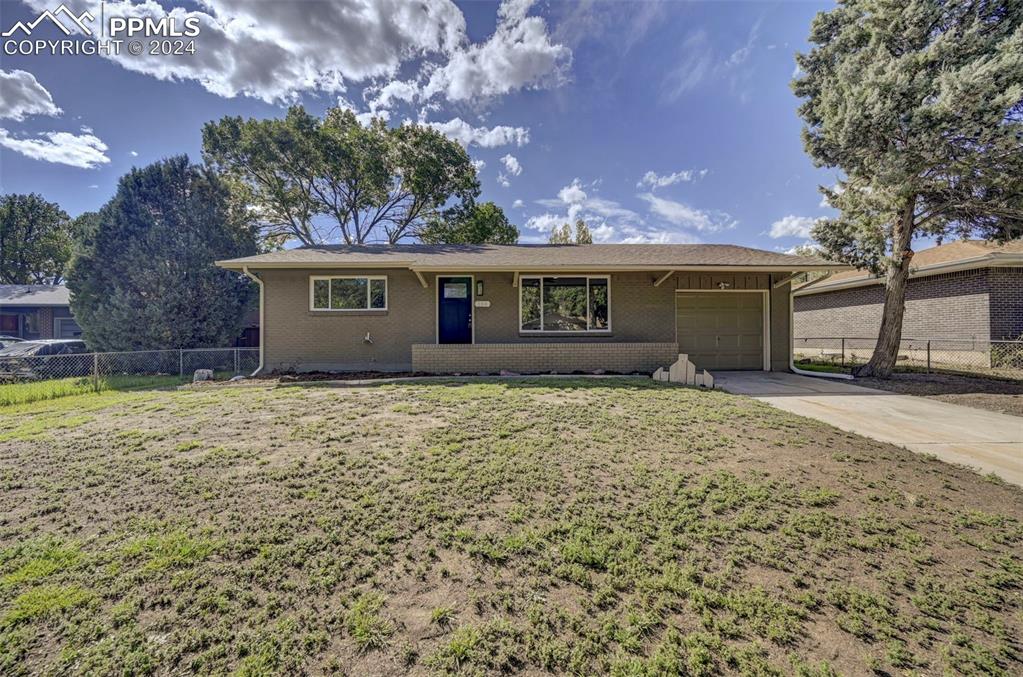 front view of a house with a yard