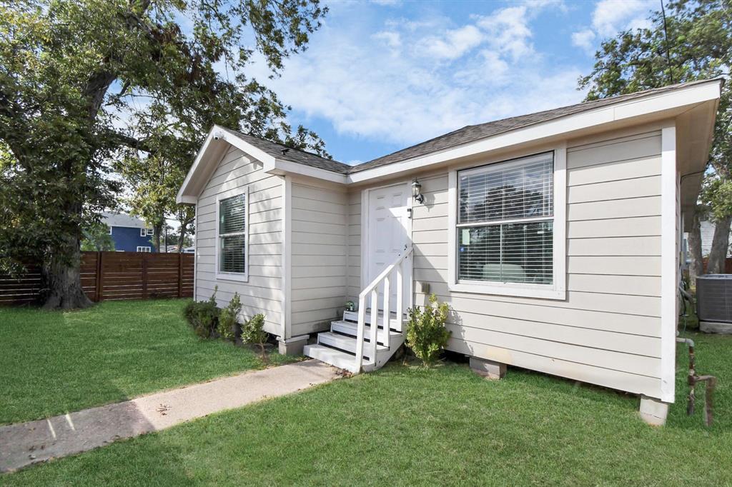 a view of backyard with a garden and deck