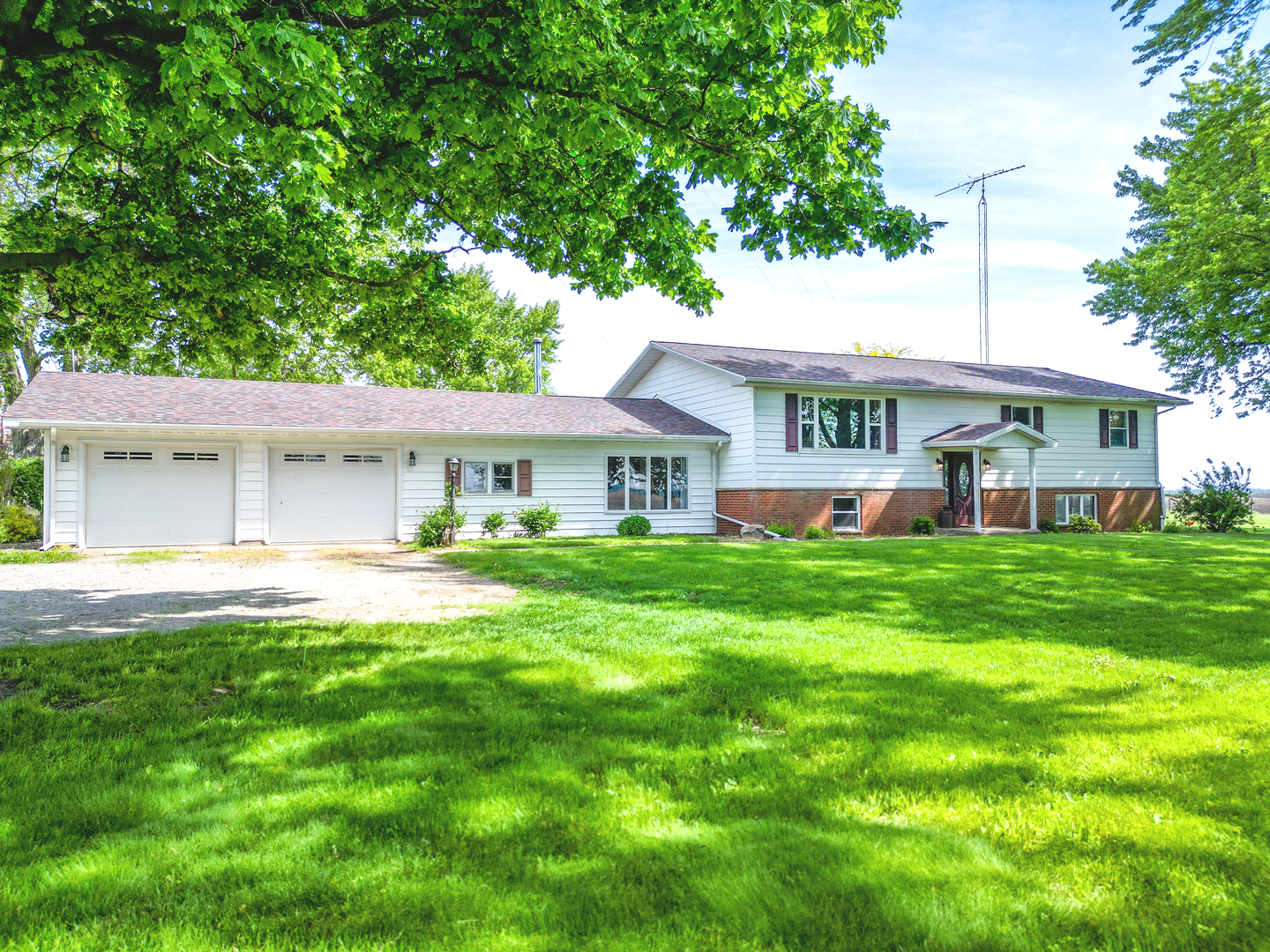 a front view of house with yard and seating area