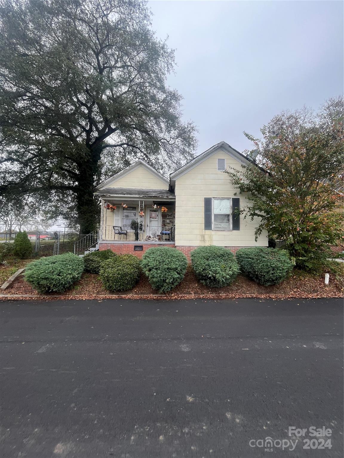 a front view of a house with a yard and a garage