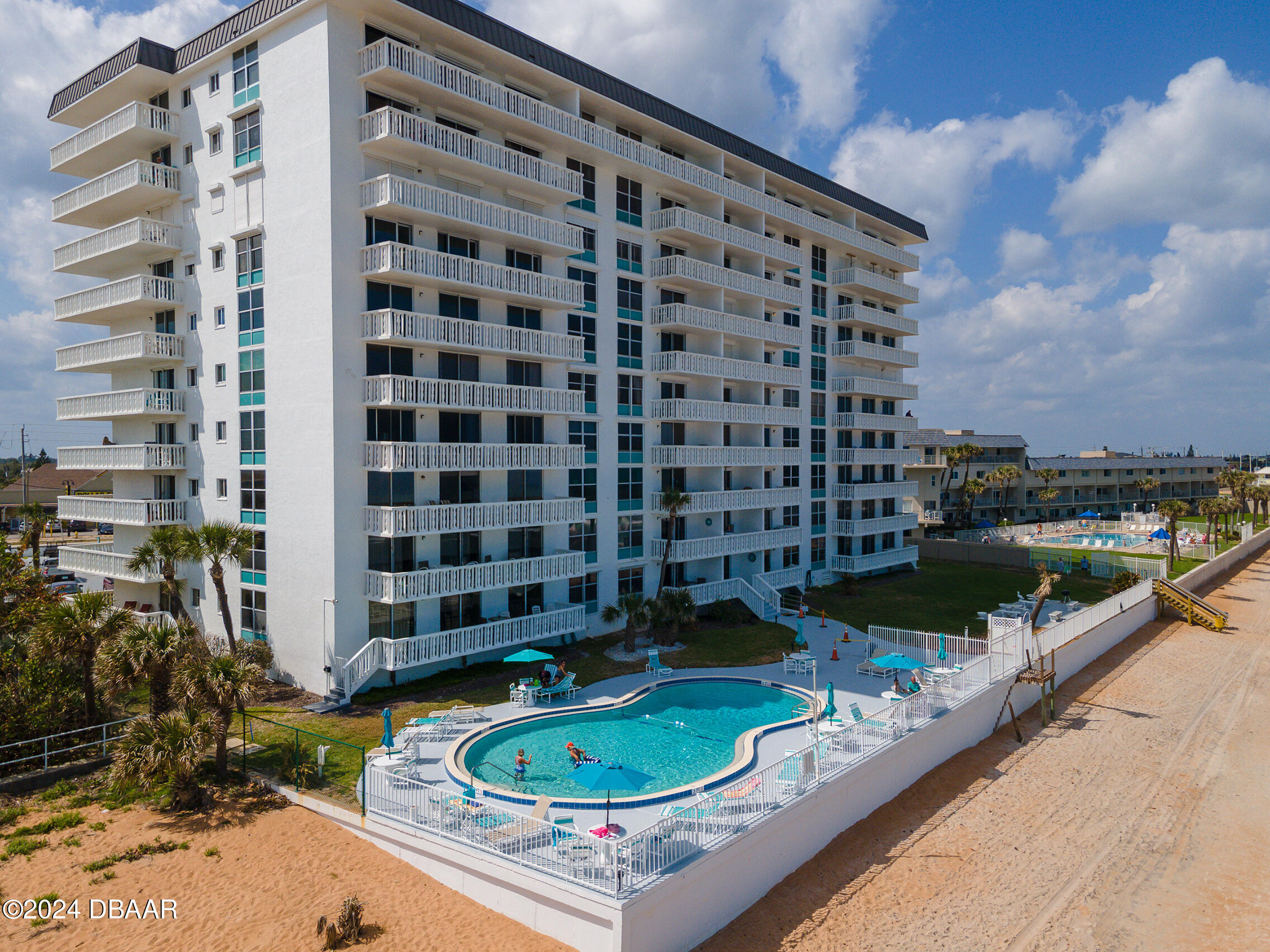 a view of a swimming pool with a patio