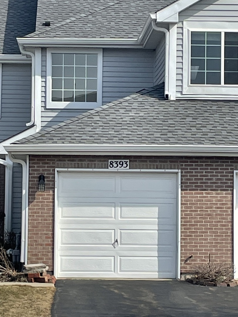 a view of house with garage