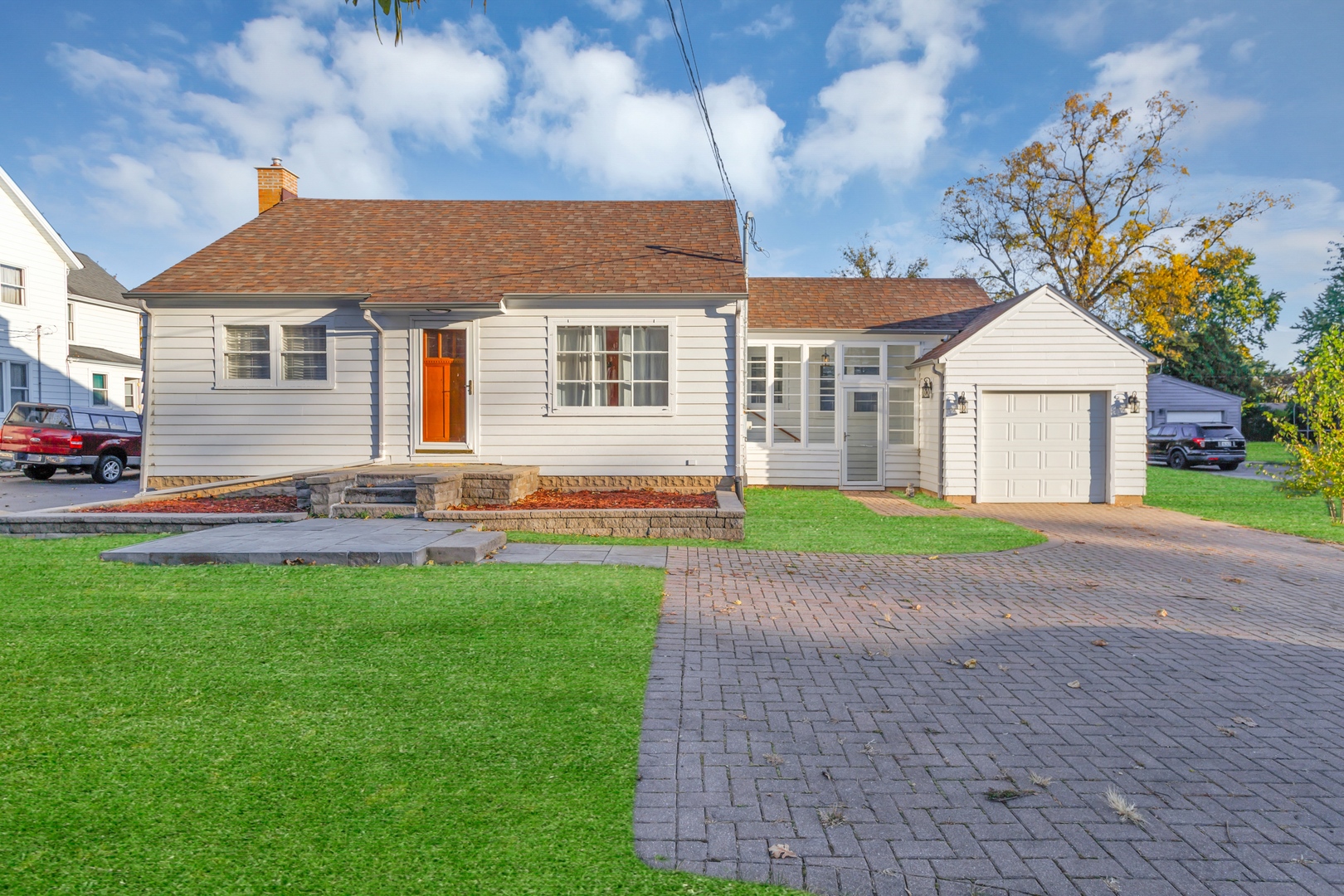 a front view of house with yard and green space