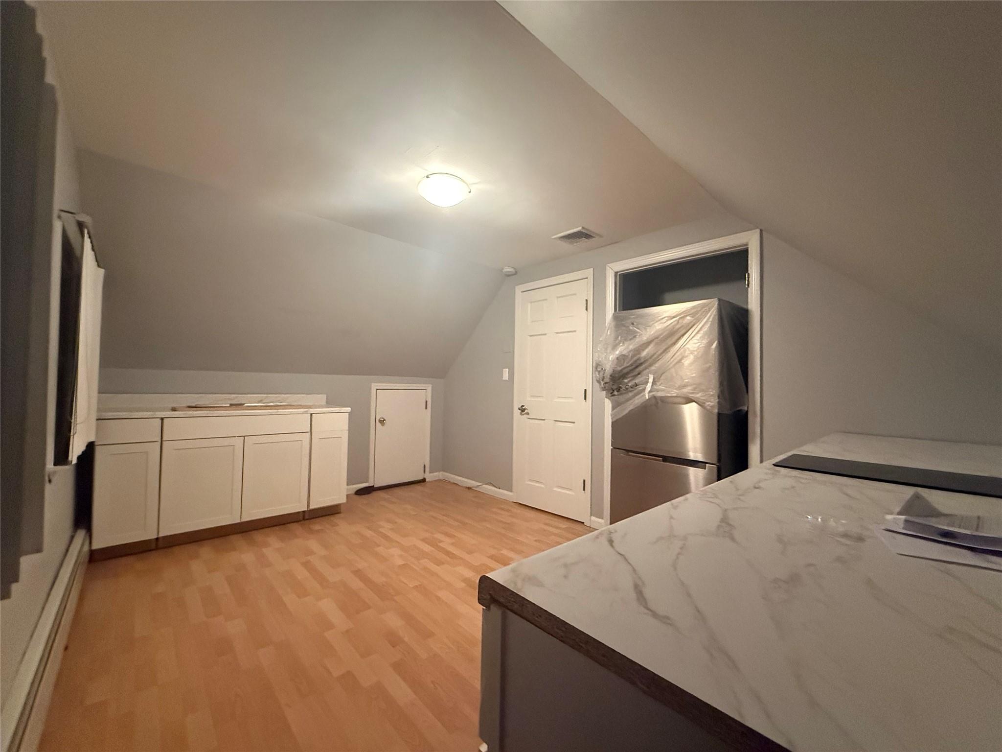 a view of a kitchen with a sink