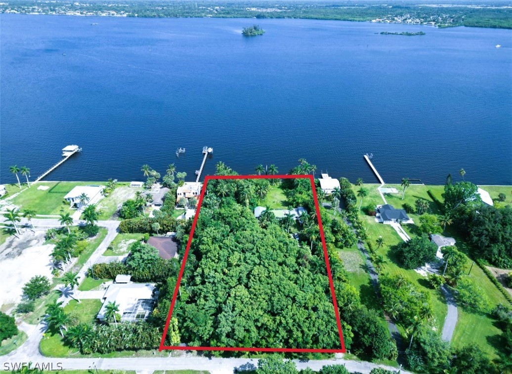 a view of a lake with a house in the background