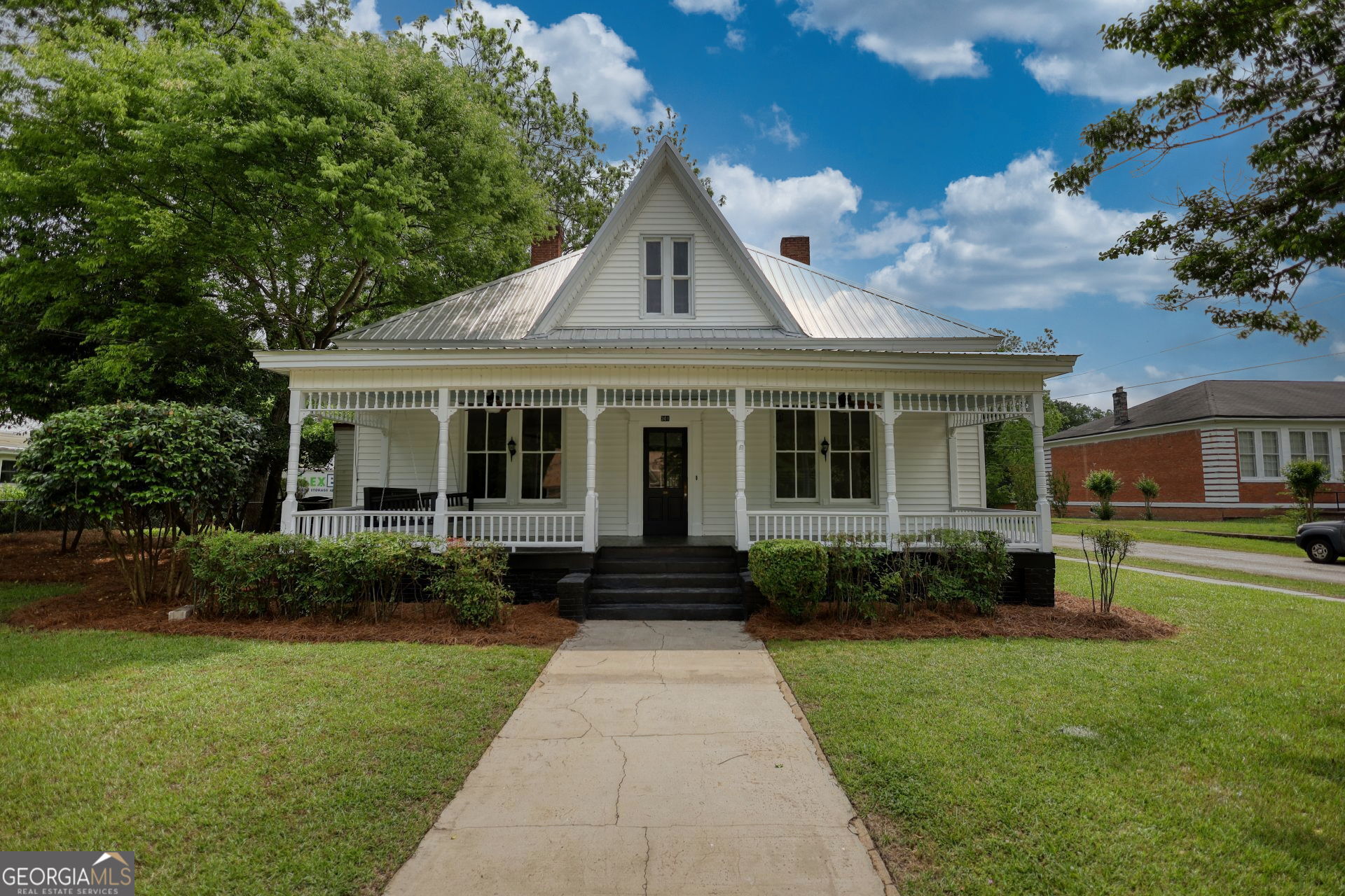 a front view of a house with a yard